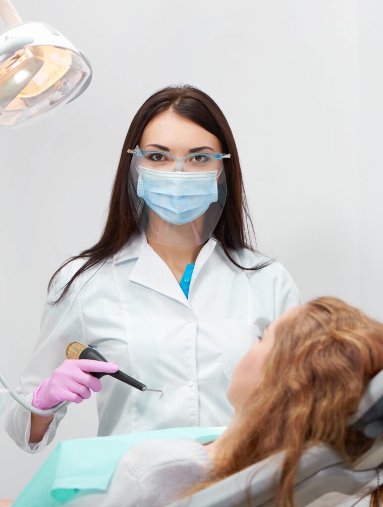 professional female dentist at work 9SDJLQ4 e1616852692593